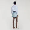 Jeans- en suède short met klinknagels Jeans- en suède short met klinknagels
