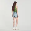 Jeansshort met lederen details Jeansshort met lederen details