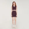Mini-gebreide rok met decoratieve details Mini-gebreide rok met decoratieve details