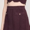 Mini-gebreide rok met decoratieve details Mini-gebreide rok met decoratieve details