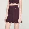 Mini-gebreide rok met decoratieve details Mini-gebreide rok met decoratieve details