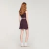 Mini-gebreide rok met decoratieve details Mini-gebreide rok met decoratieve details