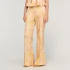 Soepelvallende broek met bloemenprint Soepelvallende broek met bloemenprint